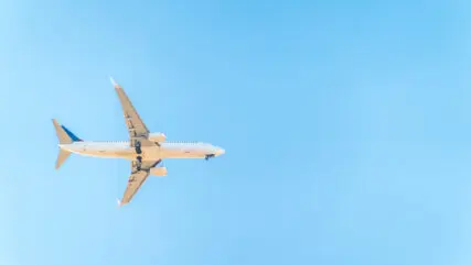 blue sky with a plane flying