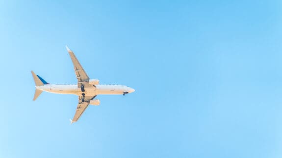 blue sky with a plane flying