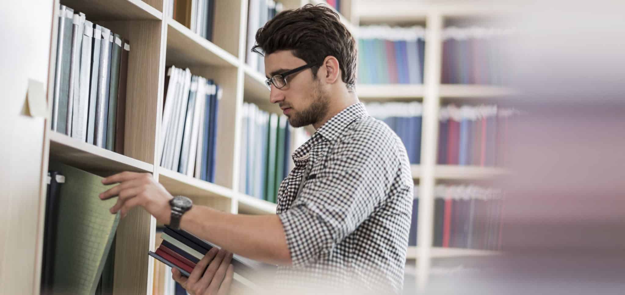 Young man taking books in one of the UK's University Technical Colleges.