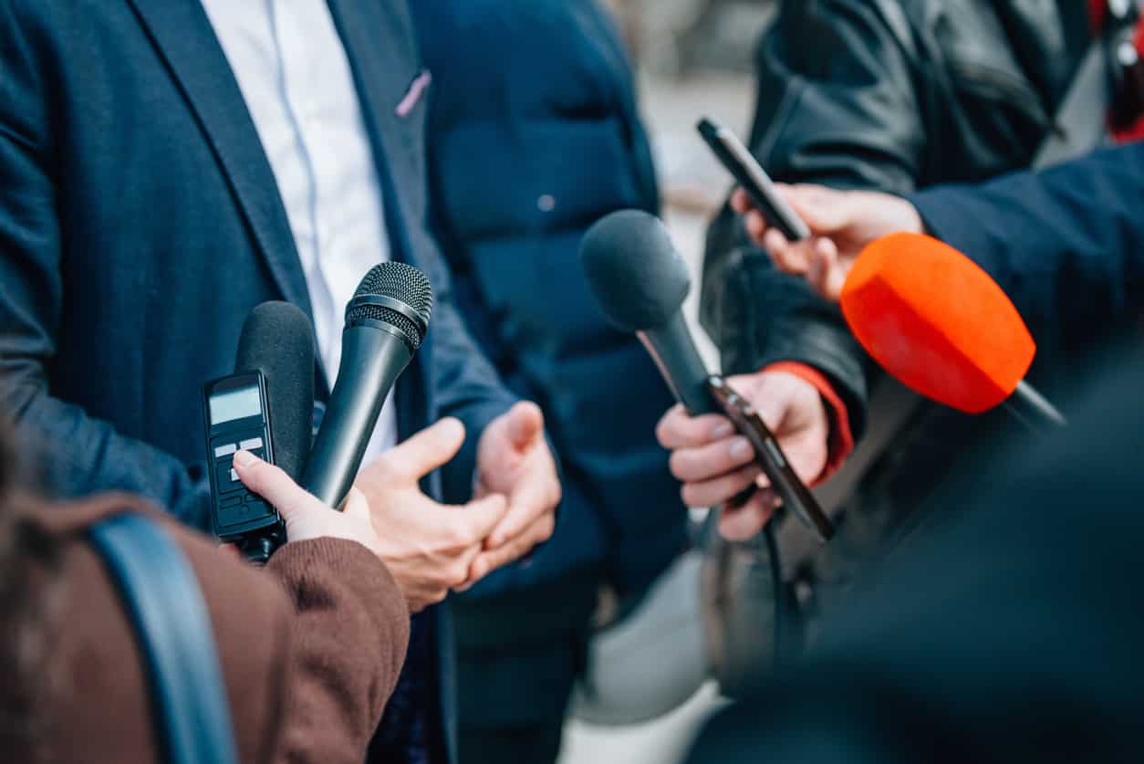 Press interviewing a charity