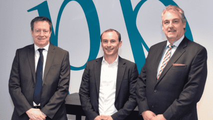 Paul, Adam, and Martin are standing together in the Price Bailey office.