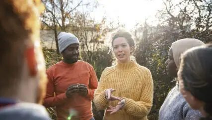 group of people in forest discussing Charities and Not-for-profit accountants