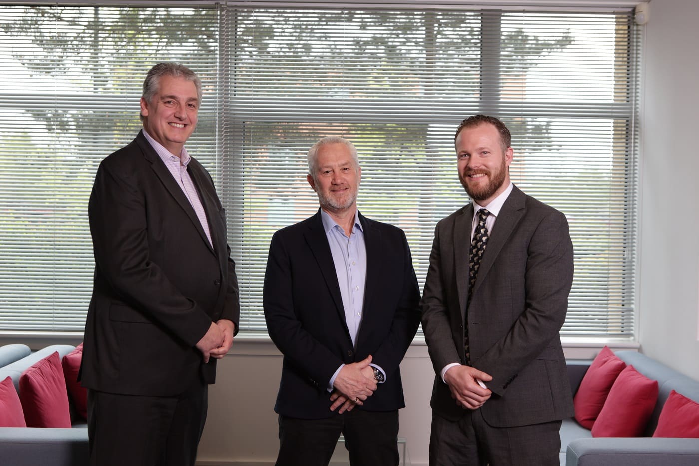 Martin Clapson, Managing Director, Greg Mayne, VAT Partner and Rich Grimster standing in office smiling