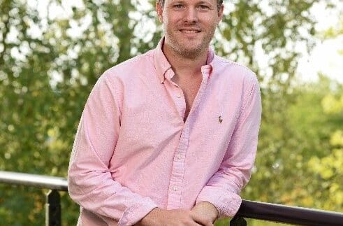 Richard Grimster on his staff photo standing outside