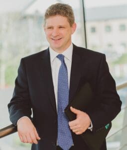Aaron Widdows staff photo standing in office