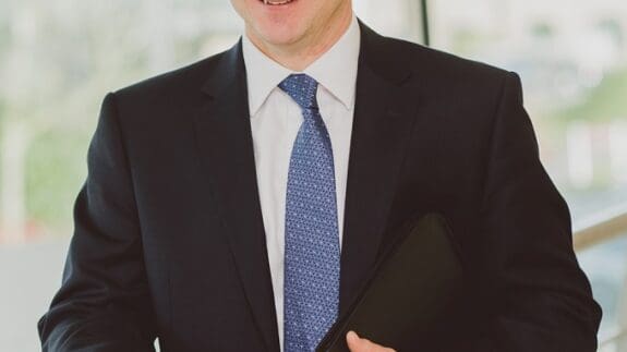 Aaron Widdows staff photo standing in office