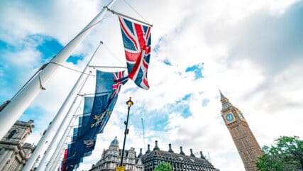 Flags flying with London skyline