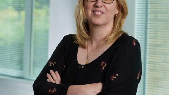 Donna staff photo standing in office