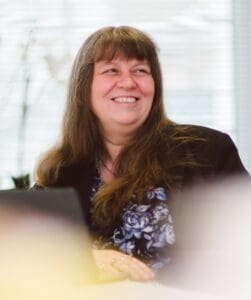 Headshot of Helena Wilkinson in the office smiling