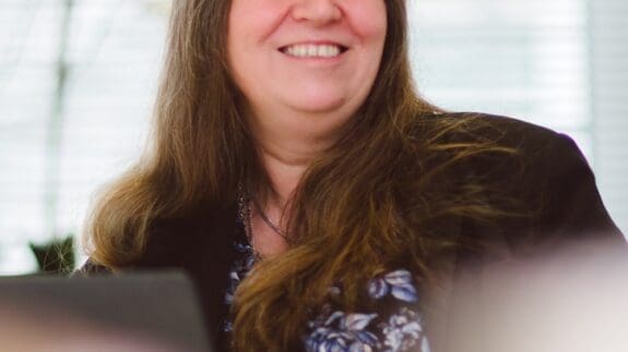 Headshot of Helena Wilkinson in the office smiling