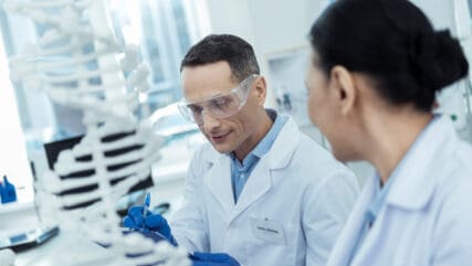 Two researchers in a lab conducting a study.