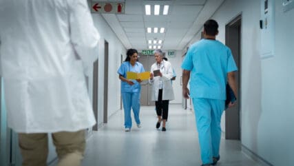 doctors walking in hospital corridor