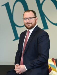 Nathan Young sitting in Cambridge office