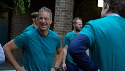 A photo of Jamie Gladstone with a teal tshirt on for Price Bailey's 2023 charity day.