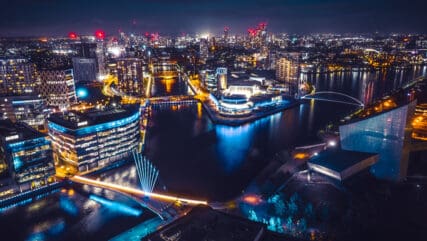 Drone view of Media city Salford quays at night, Manchester.