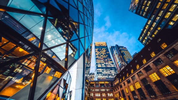 Looking directly up at the skyline of the financial district in central London