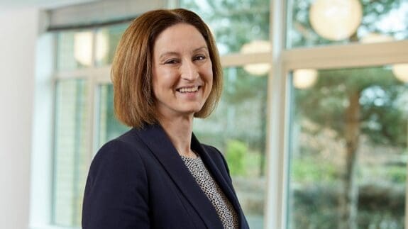 Photo of Suzanne Goldsmith stood in the Price Bailey Cambridge office.
