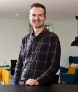 Photo of Will Short stood in the Price Bailey Bishop's Stortford office.