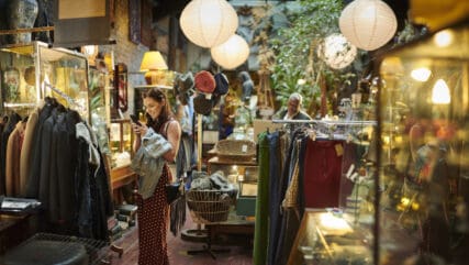 Woman in shop looking at phone