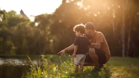 Father showing lake to his son