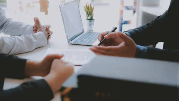 lawyer insurance broker consulting giving legal advice to couple customer about buying renting house. financial advisor with mortgage loan investment contract. Real Estate Agent selling real estate
