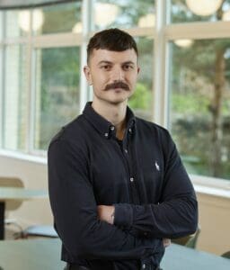 Tomas Walters standing in Cambridge office