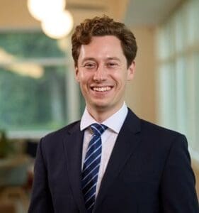 James Bloxham smiling Cambridge office