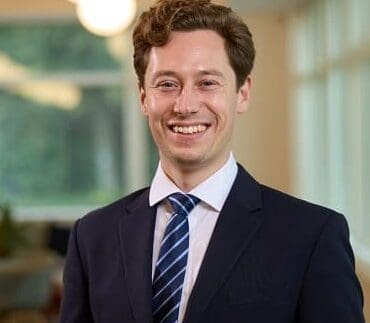James Bloxham smiling Cambridge office