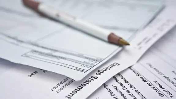 Bank statement and cheque used for payroll outsource and payroll administration